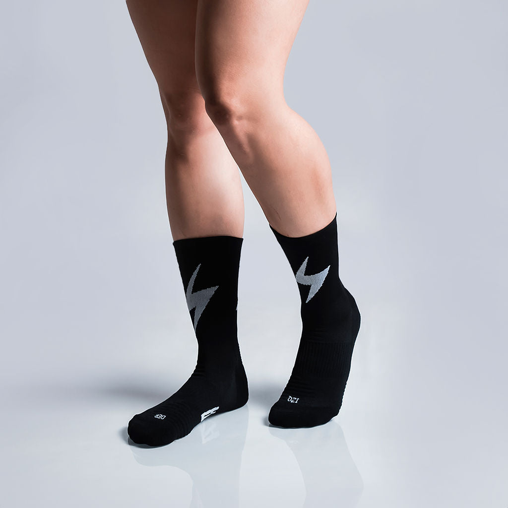 Calcetas deportivas Pro Thunder para running, maratón y ciclismo. Con diseño técnico transpirable, compresión media y soporte en arco plantar, costura antiampollas.